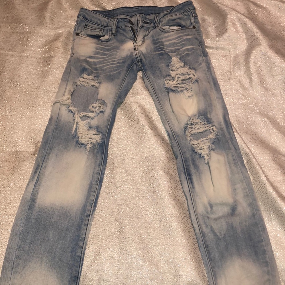 Acid washed ripped jeans